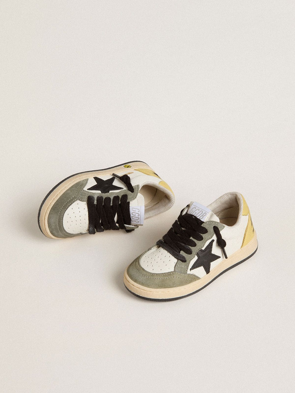 Ball Star Young in white nappa with dark green suede inserts and black star